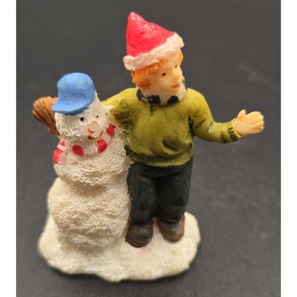 2004 Holiday Time boy with Snowman  Christmas Village Figurine